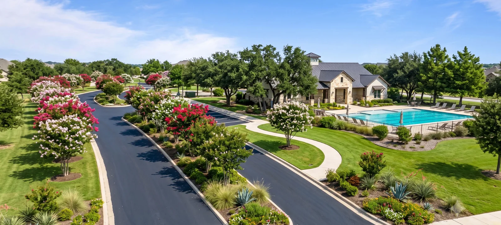 A well-maintained HOA common area — a clubhouse, pool, and paved entrance kept in good repair by a funded reserve plan